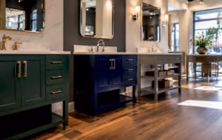 Display of three modern bathroom vanities in showroom