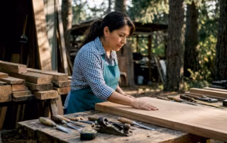 Woodworker inspecting sustainable architectural millwork